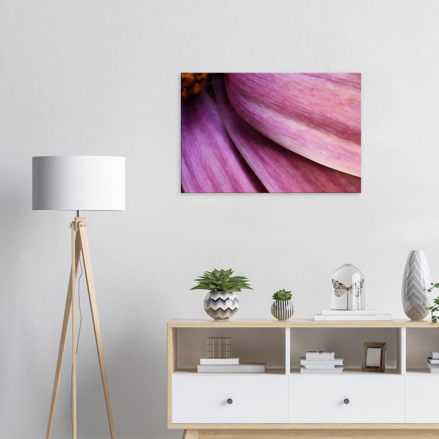 White harmonous room with a colourful pink and purple flower photo on the wall